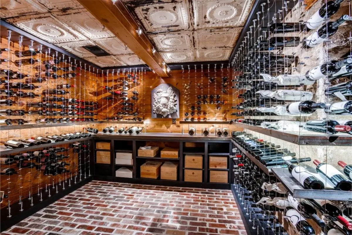 Custom wine cellar with floor-to-ceiling metal racks for organized bottle display.