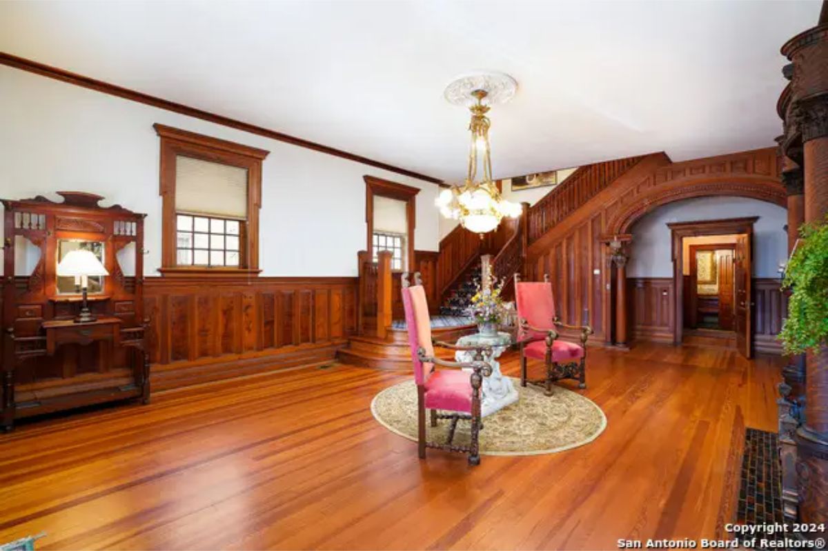 Intricate wood paneling and beautifully polished longleaf pine flooring.