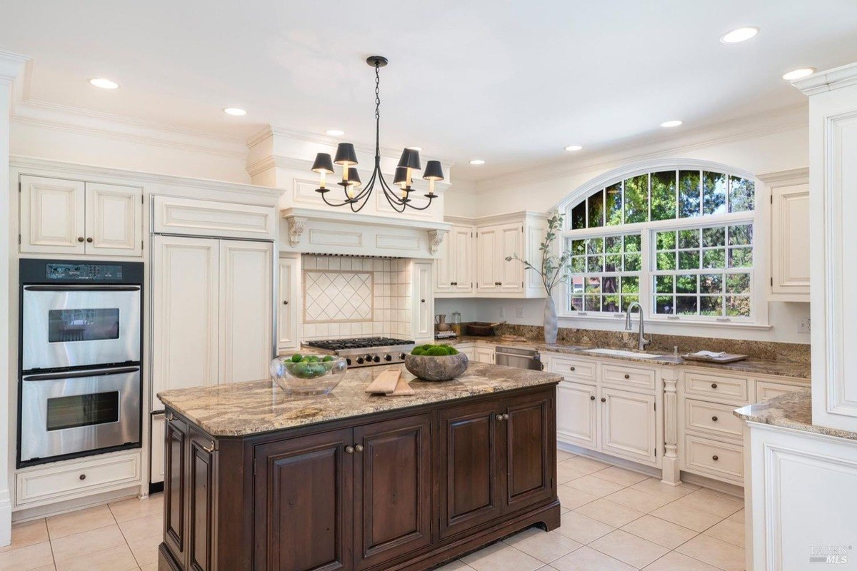 Kitchen with a stainless steel appliances, and elegant cabinetry, perfect for culinary endeavors and entertaining.