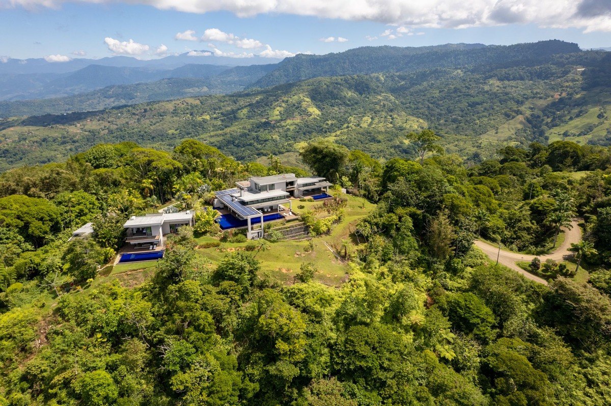 Hilltop home has mountain and ocean views.