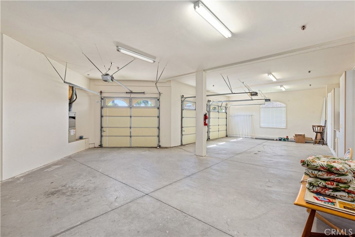 Expansive garage space accommodates multiple vehicles with open layout.