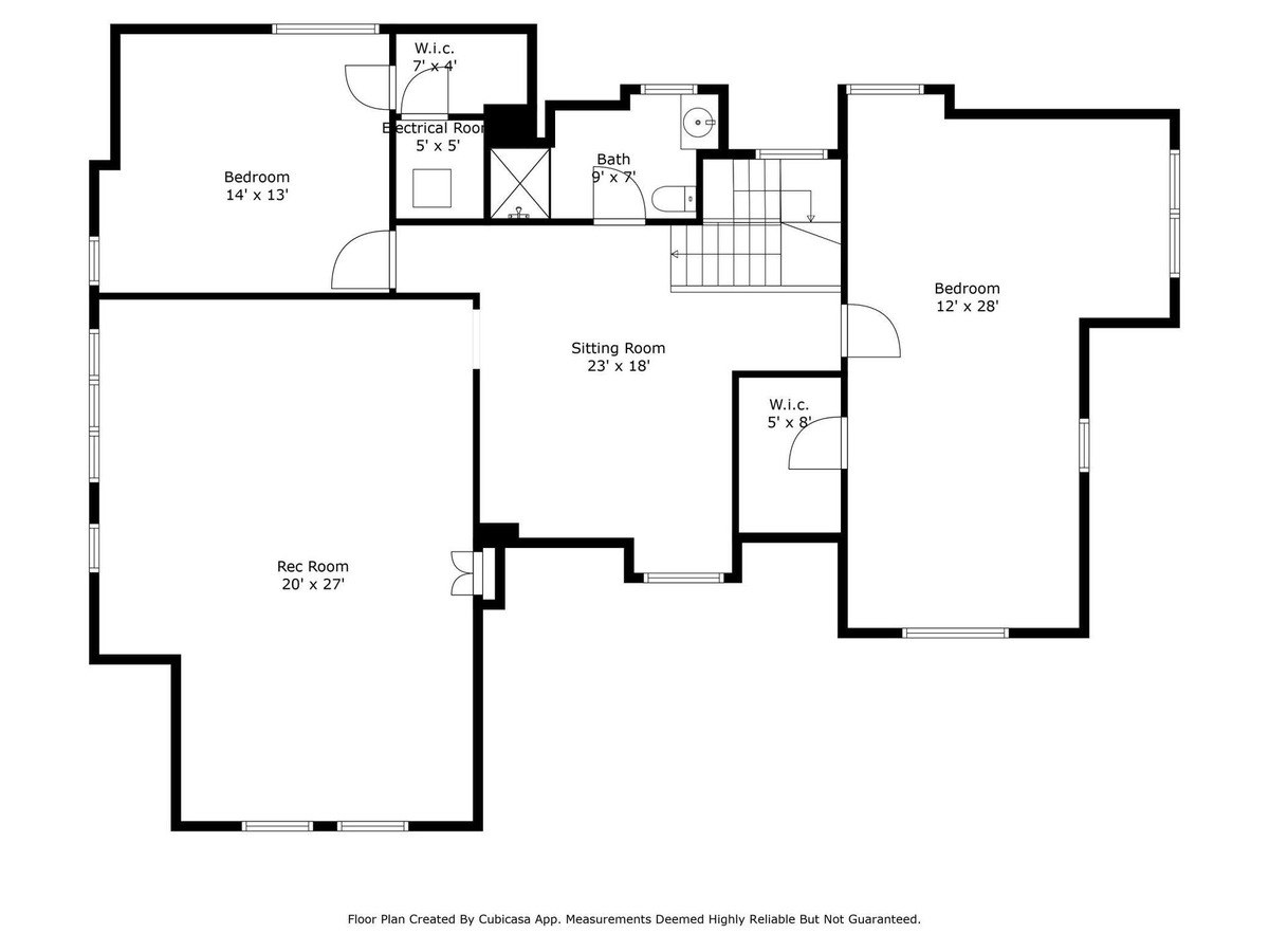 Floor plan shows a home's upper level with two bedrooms, a sitting room, a bathroom, and walk-in closets.