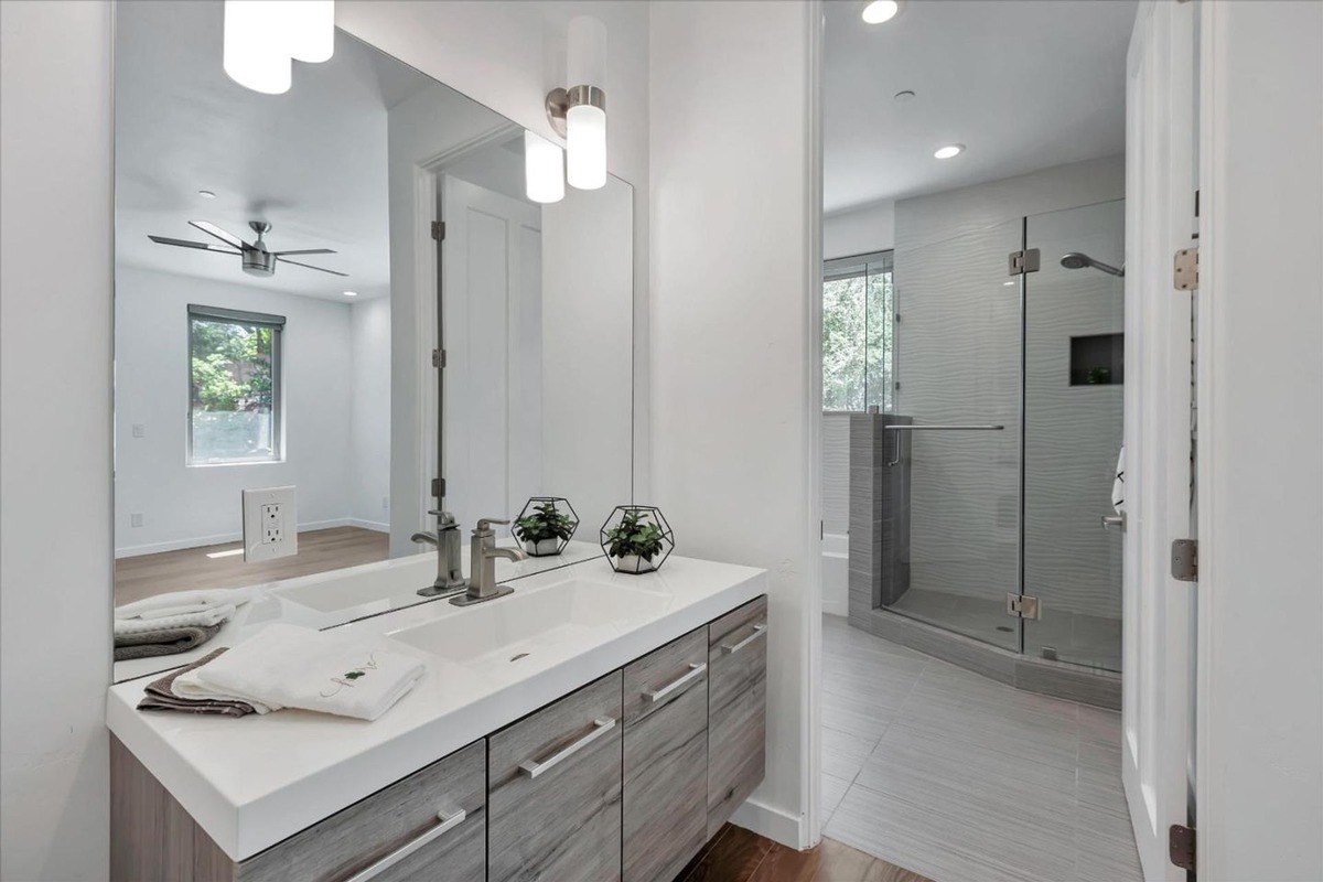 Ensuite bathroom a sleek bathroom with a walk-in shower and a large vanity.