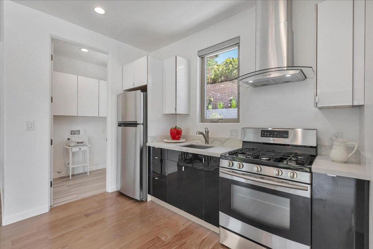 Modern kitchen featuring stainless steel appliances and sleek cabinetry.