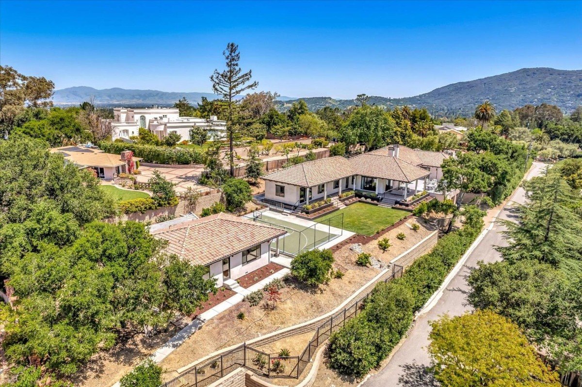 Aerial view of the property highlighting the expansive layout and surrounding greenery.