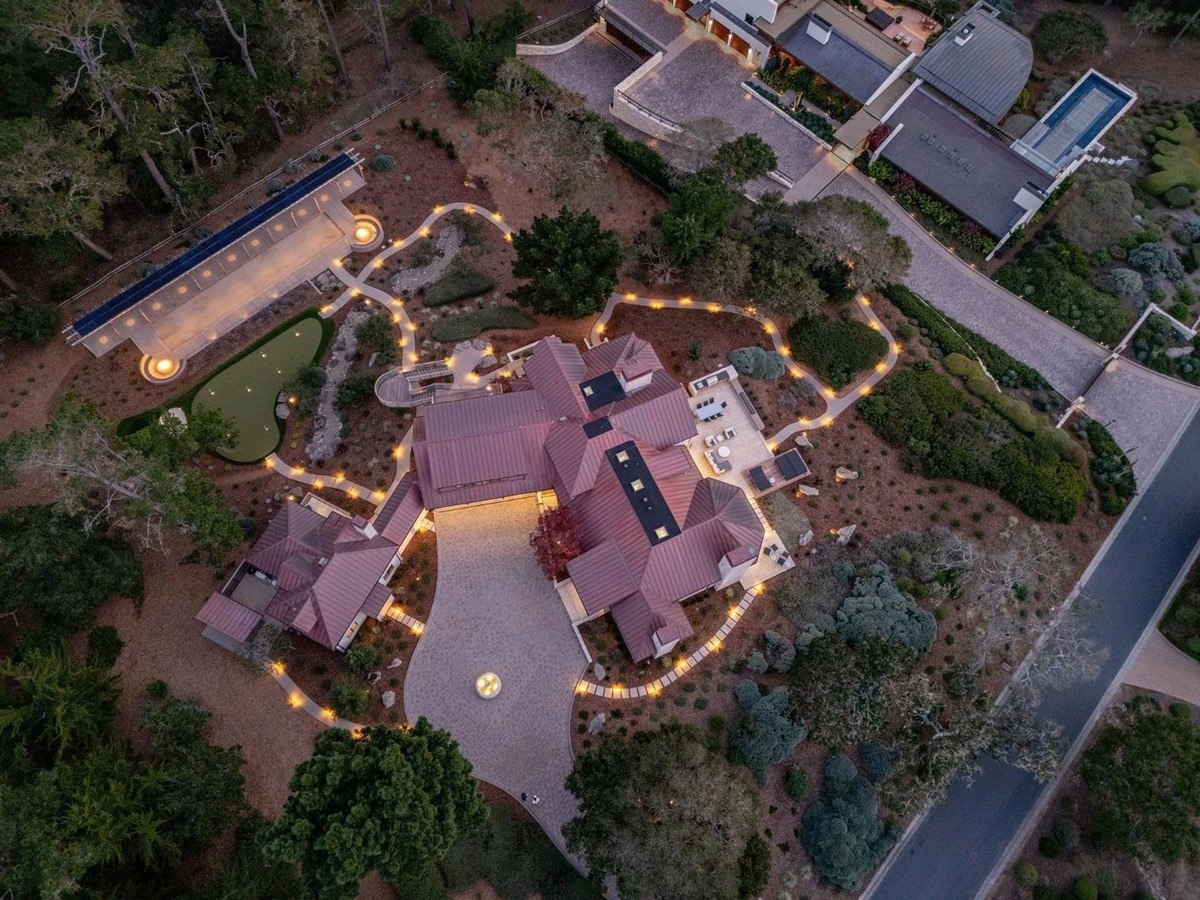 Aerial view of the property, highlighting the home's expansive grounds, outdoor amenities, and surrounding landscape.