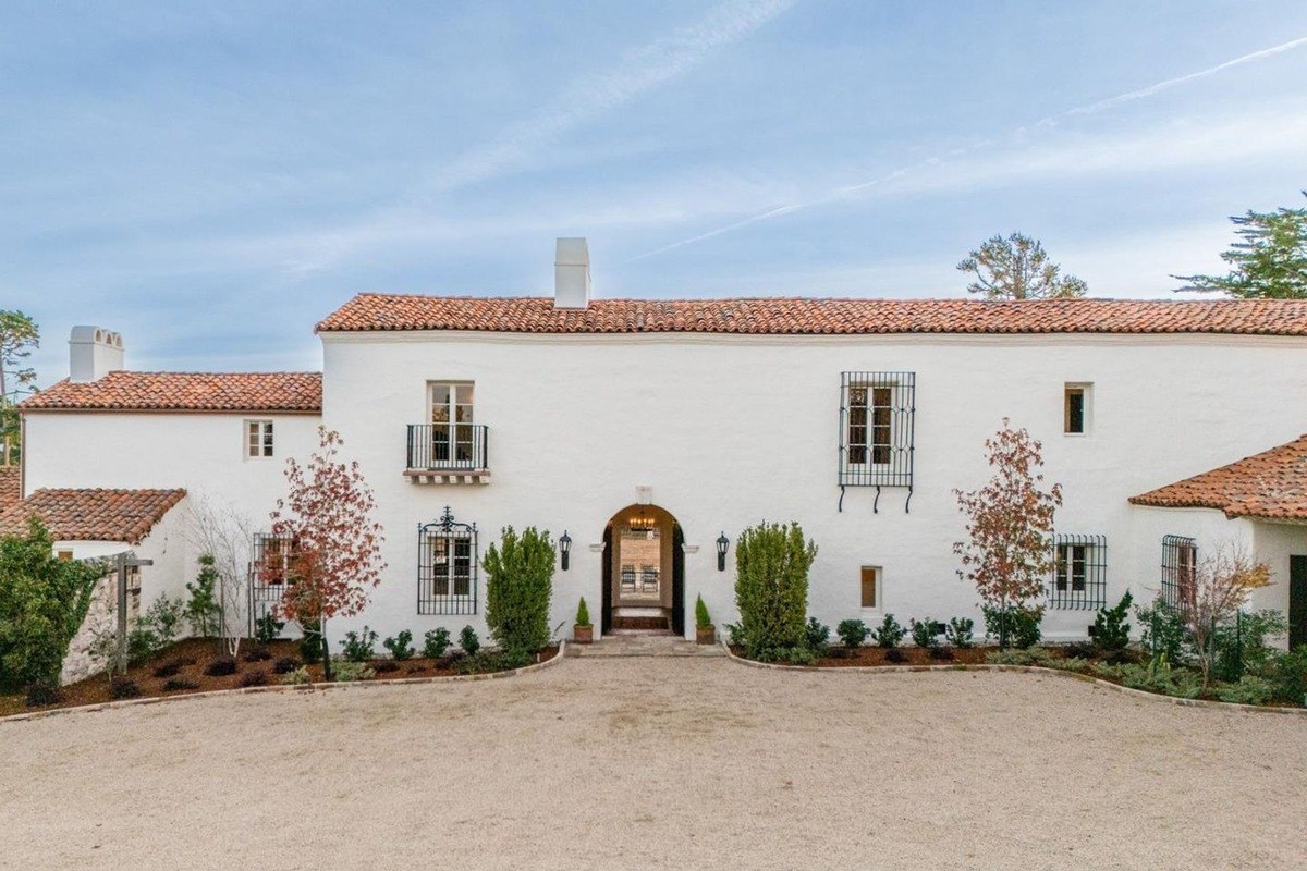 Charming exterior exhibits a red-tiled roof along with well-kept gardens, capturing a serene atmosphere.