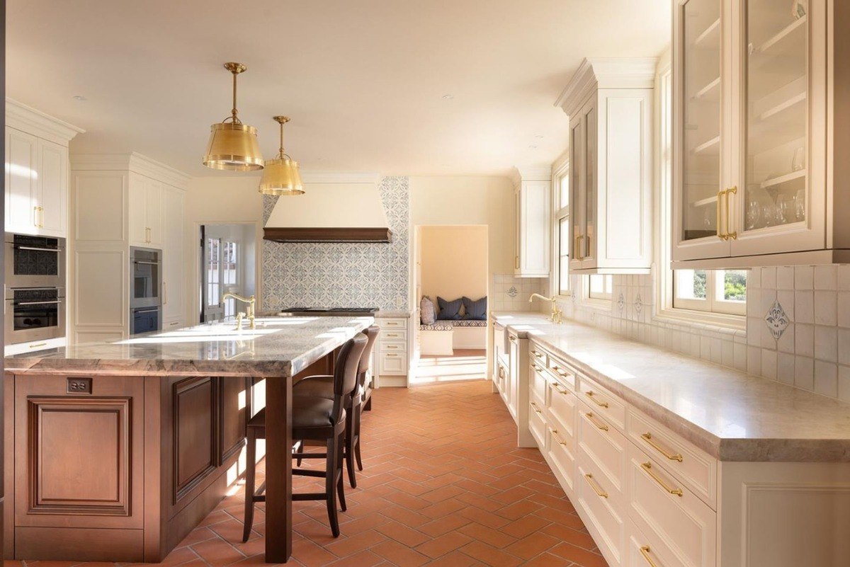 Richly appointed study with dark wood paneling and a coffered ceiling provides a warm, inviting atmosphere.