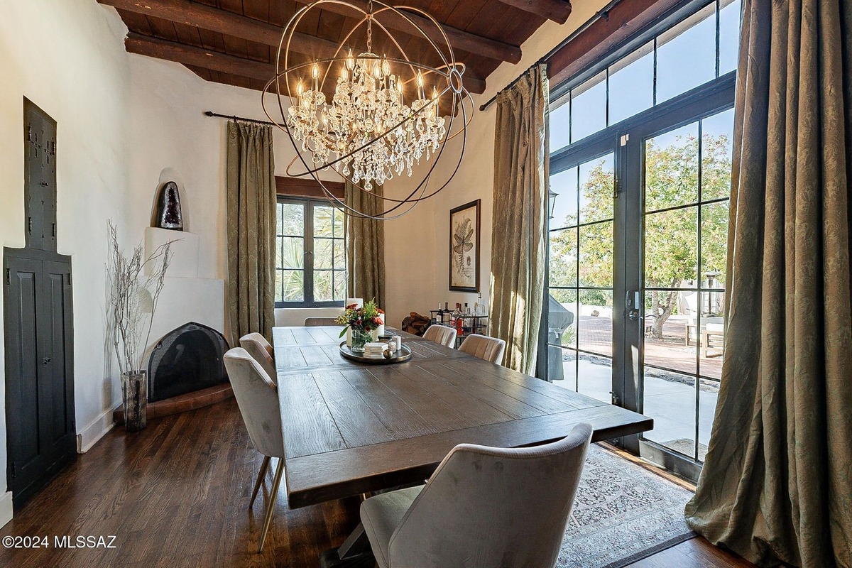 Comfortable seating area with a mix of armchairs, vibrant cushions, and framed artwork.